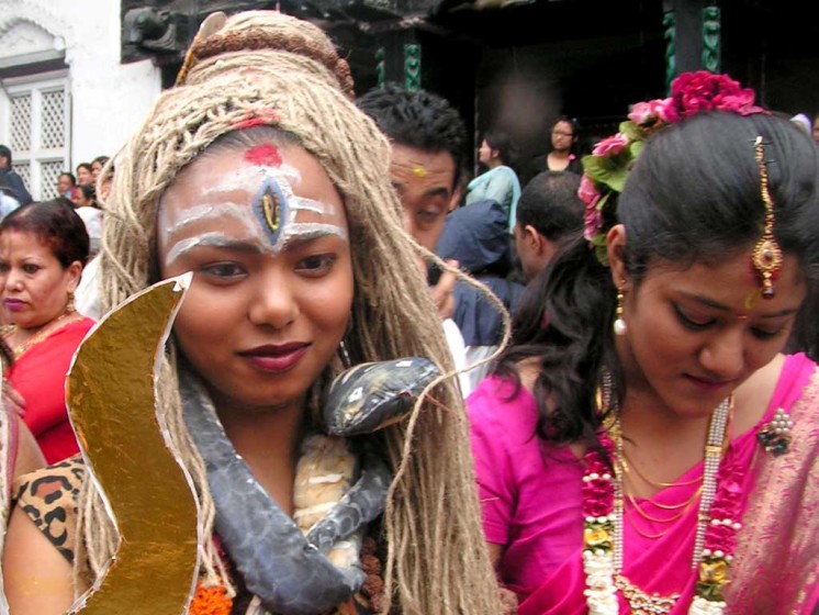A lady depicting herself as Shiva during Gai Jatra Festival in Kathmandu