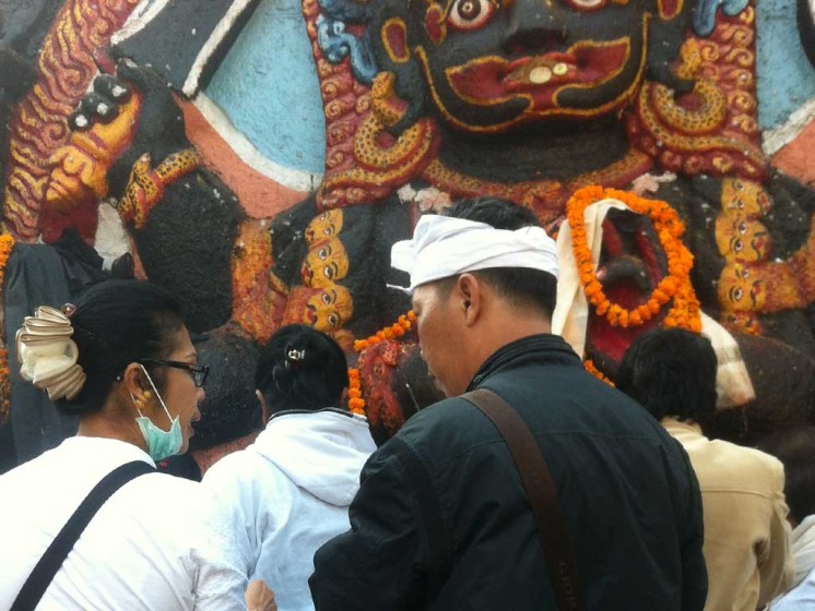 Balinese Hindus praying in front of Kal Bhairav temple in Kathmandu durbar Square